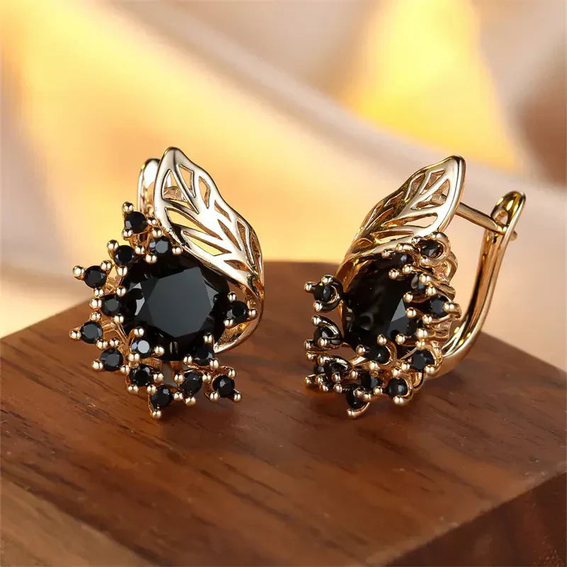 Boucles d'oreilles dorées avec zircon noir | Or