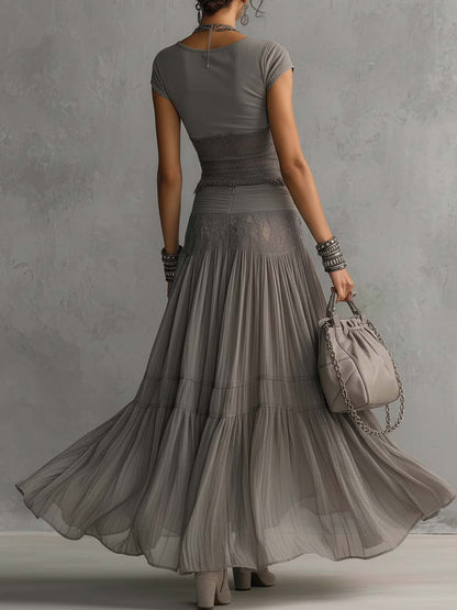 Ginevra · Ensemble top transparent à empiècements en dentelle noire et jupe longue plissée