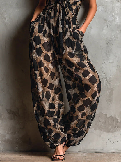 Roberta · Combinaison ample en mousseline noire à imprimé animalier, col dos-nu et pantalon large